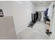 Spacious walk-in closet or dressing room with tile floors and ample storage space at 21985 E Quintero Rd, Queen Creek, AZ 85142