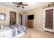 Comfortable bedroom featuring a ceiling fan, plush carpeting, and neutral tones at 22304 N 104Th Ln, Peoria, AZ 85383
