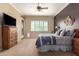 Bedroom with soft natural light, ceiling fan, and a cozy atmosphere at 22304 N 104Th Ln, Peoria, AZ 85383