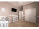 Cozy bedroom featuring neutral tones, a changing table, and a closet for ample storage at 22304 N 104Th Ln, Peoria, AZ 85383