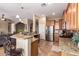 Open concept kitchen boasts granite countertops, stainless appliances, and a breakfast bar at 22304 N 104Th Ln, Peoria, AZ 85383