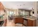 Open concept kitchen features granite countertops, stainless appliances, and ample cabinet space at 22304 N 104Th Ln, Peoria, AZ 85383