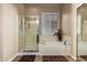 Bright bathroom featuring a glass-enclosed shower and separate tub, perfect for relaxation and convenience at 22304 N 104Th Ln, Peoria, AZ 85383
