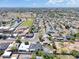 An aerial view capturing the vast neighborhood landscape, highlighting community layout and surrounding greenery at 2353 N 51St Pl, Phoenix, AZ 85008