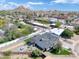 Aerial view of home highlighting updated roof, outdoor living areas, and mature trees with mountain views at 2353 N 51St Pl, Phoenix, AZ 85008