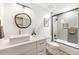 Updated bathroom with a stylish sink, a soaking tub/shower combo, and contemporary fixtures at 2353 N 51St Pl, Phoenix, AZ 85008