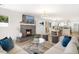 Living room showcasing a fireplace, dining, and kitchen area at 2353 N 51St Pl, Phoenix, AZ 85008