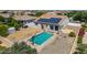 Aerial shot of a home with a pool, solar panels, and a dirt lot ready for landscaping at 24350 S 208Th Pl, Queen Creek, AZ 85142