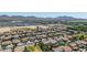 Expansive aerial view of a residential neighborhood with pools and mountain backdrop at 24350 S 208Th Pl, Queen Creek, AZ 85142