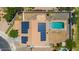 View of solar panels on the roof, complemented by a serene pool area in the backyard, promising relaxation and savings at 24350 S 208Th Pl, Queen Creek, AZ 85142