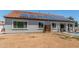 Backyard view with a pool, covered patio and solar panels on the roof at 24350 S 208Th Pl, Queen Creek, AZ 85142