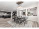 Spacious dining area with a dark wood table and views of the kitchen area at 24350 S 208Th Pl, Queen Creek, AZ 85142