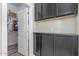 This bright laundry room is equipped with ample cabinet space and a walk-in closet for maximum storage at 24350 S 208Th Pl, Queen Creek, AZ 85142
