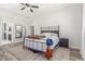 Main bedroom features neutral tones, large bed frame and modern carpet at 24350 S 208Th Pl, Queen Creek, AZ 85142