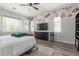 Bedroom with decorative wall accents, ceiling fan, and natural light at 24350 S 208Th Pl, Queen Creek, AZ 85142