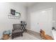 Cozy office space with chair, shelving decor, and double closet door at 24350 S 208Th Pl, Queen Creek, AZ 85142