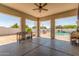 Covered patio with grill and clear view of sparkling pool at 24350 S 208Th Pl, Queen Creek, AZ 85142