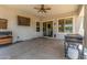 Covered patio space including ceiling fan and bbq grills at 24350 S 208Th Pl, Queen Creek, AZ 85142