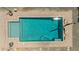 Clear view of pristine pool surrounded by pavers with a shallow end and diving board, featuring chairs and a small waterfall at 24350 S 208Th Pl, Queen Creek, AZ 85142