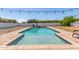 Beautiful in-ground pool with brick trim and ample space at 24350 S 208Th Pl, Queen Creek, AZ 85142