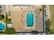 A pristine rectangular pool is surrounded by pavers and a low wall and features diving board and a shallow end at 24350 S 208Th Pl, Queen Creek, AZ 85142