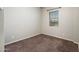 Bedroom features neutral walls, carpet flooring, window with blinds, and baseboards at 2611 S Quaintance St, Gilbert, AZ 85295