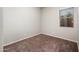 Bedroom features neutral walls, carpet flooring, window with blinds, and baseboards at 2611 S Quaintance St, Gilbert, AZ 85295