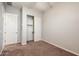 Bedroom showcases neutral walls, carpet flooring, closet, and baseboards at 2611 S Quaintance St, Gilbert, AZ 85295