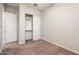 Bedroom showcases neutral walls, carpet flooring, closet, and baseboards at 2611 S Quaintance St, Gilbert, AZ 85295