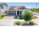 Charming single-Gathering home boasting a well-maintained lawn, paver driveway, and welcoming front porch at 2611 S Quaintance St, Gilbert, AZ 85295
