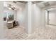 Bright home office features wood-look floors, archway, a ceiling fan, and a neutral color palette at 2611 S Quaintance St, Gilbert, AZ 85295