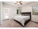 Main bedroom with a ceiling fan and windows at 2611 S Quaintance St, Gilbert, AZ 85295