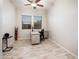 Office features tile flooring, windows with blinds, desk and chair, and ceiling fan at 2611 S Quaintance St, Gilbert, AZ 85295