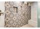Beautifully tiled shower featuring a built-in bench and niche at 2611 S Quaintance St, Gilbert, AZ 85295