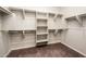 Spacious walk-in closet with built-in shelves and rods at 2611 S Quaintance St, Gilbert, AZ 85295