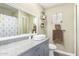 Comfortable bathroom featuring granite countertops, neutral cabinets, and decorative accents at 2650 W Union Hills Dr # 98, Phoenix, AZ 85027
