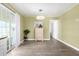 Dining area with wood-look floors, chandelier, and sliding glass door at 2650 W Union Hills Dr # 98, Phoenix, AZ 85027