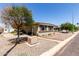 Exterior view of home featuring desert landscaping with gravel and low-maintenance plants at 2650 W Union Hills Dr # 98, Phoenix, AZ 85027