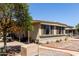 Exterior view of a home showing shutters, desert landscaping and a covered patio area at 2650 W Union Hills Dr # 98, Phoenix, AZ 85027