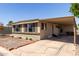 A home showcasing a covered carport with adjacent desert landscaping at 2650 W Union Hills Dr # 98, Phoenix, AZ 85027