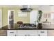 Close up of the kitchen island featuring pendant lights and modern appliances at 2650 W Union Hills Dr # 98, Phoenix, AZ 85027