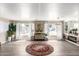 Open-concept living area with modern decor, wood-look floors, and large windows at 2650 W Union Hills Dr # 98, Phoenix, AZ 85027