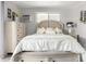 Cozy bedroom showcasing a beautifully dressed bed, neutral color palette, and stylish furnishings at 2650 W Union Hills Dr # 98, Phoenix, AZ 85027
