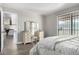 Bright bedroom featuring a vanity, sliding glass doors, and neutral decor for a comfortable retreat at 2650 W Union Hills Dr # 98, Phoenix, AZ 85027