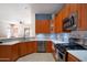Modern kitchen featuring granite countertops, stainless steel appliances, ample cabinet space, and a stylish backsplash at 26633 N 41St Way, Cave Creek, AZ 85331