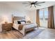 This bedroom boasts a light and airy ambiance with a wooden bed frame and matching nightstands at 28065 N 171St Dr, Surprise, AZ 85387