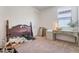 Bedroom featuring a wooden bed frame with matching desk and storage at 28065 N 171St Dr, Surprise, AZ 85387