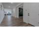 Long foyer with hardwood floors and an open floor plan at 28065 N 171St Dr, Surprise, AZ 85387