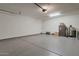 Spacious garage with coated floor, recessed lighting and ample space for storage at 28065 N 171St Dr, Surprise, AZ 85387