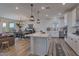 Spacious open-concept kitchen with stainless steel appliances, island and dining area at 28065 N 171St Dr, Surprise, AZ 85387